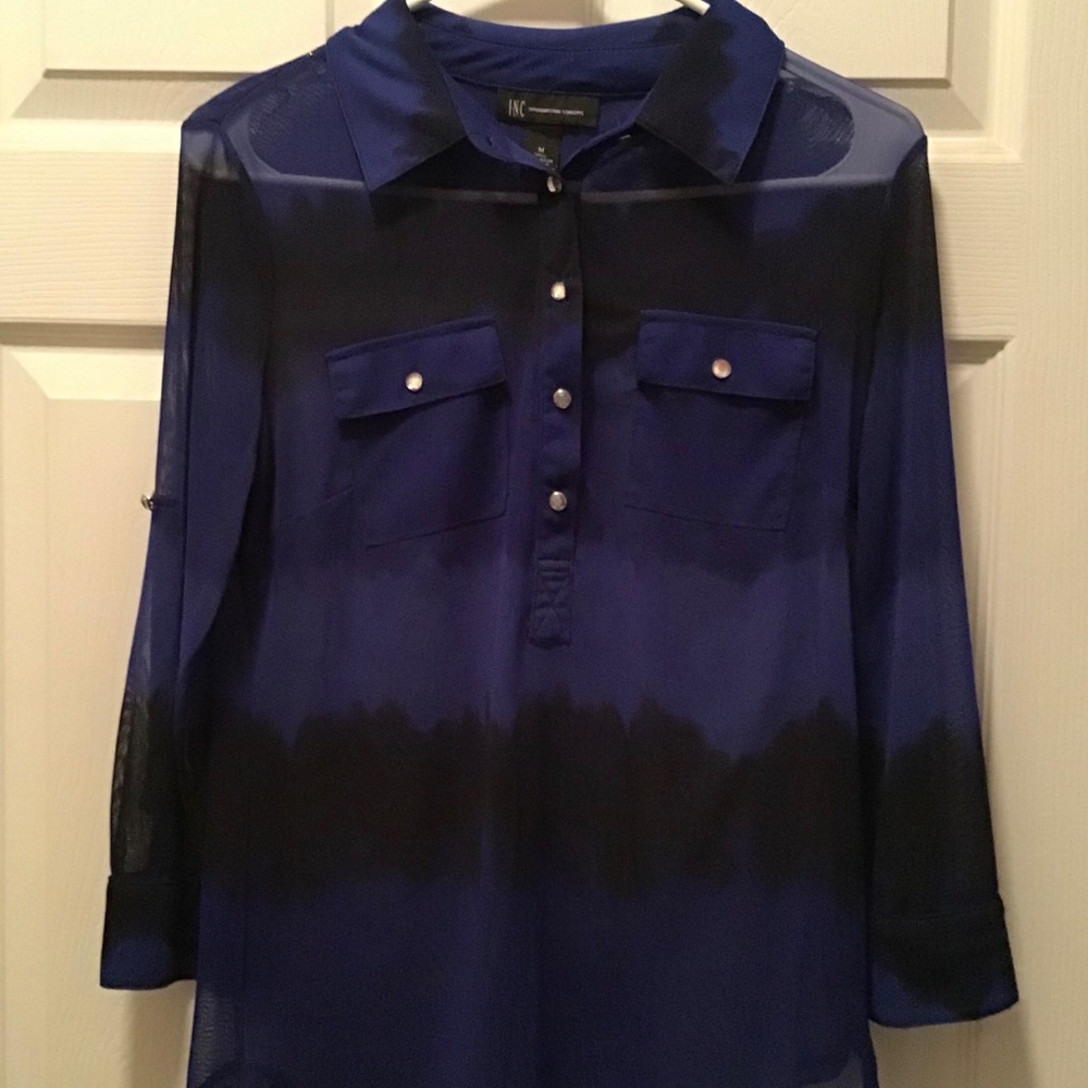 Woman’s sheer shirt. Needs a cami underneath.